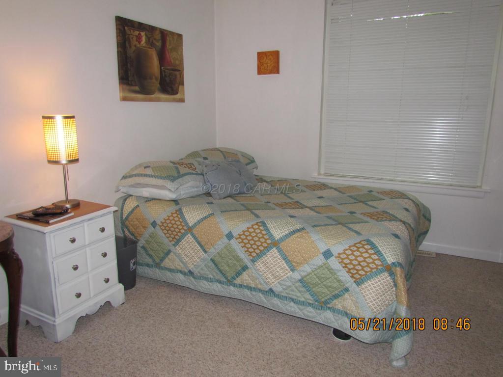 38 Sandyhook Road Ocean Pines, MD 21811 - Photo 20 of 33 a bedroom with a bed and a night stand