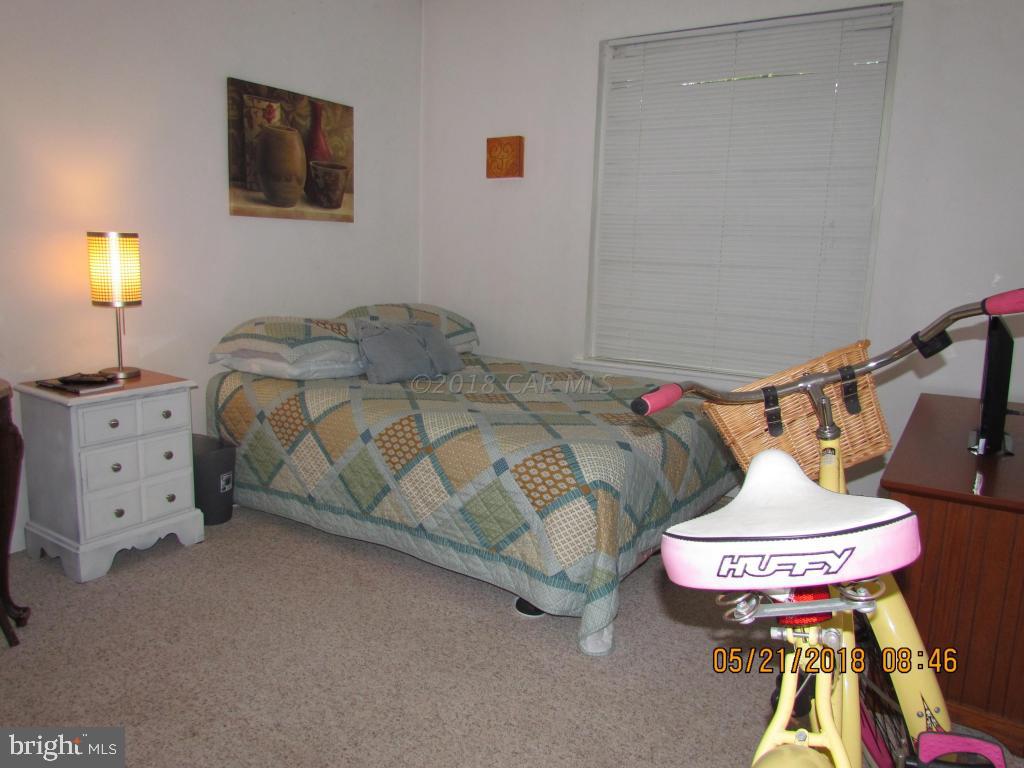 38 Sandyhook Road Ocean Pines, MD 21811 - Photo 22 of 33 a bedroom with a bed and dresser