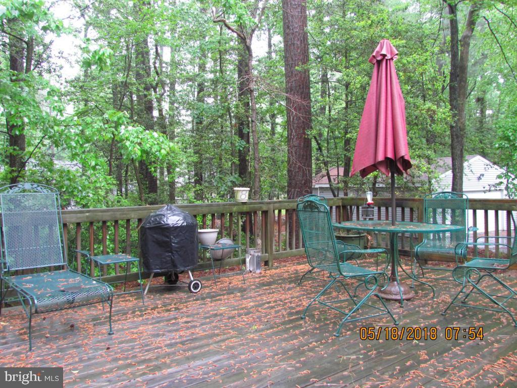 38 Sandyhook Road Ocean Pines, MD 21811 - Photo 30 of 33 a view of a deck with a table and chairs