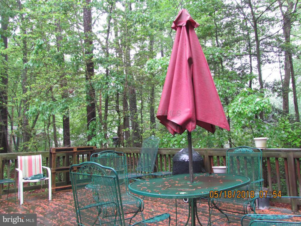 38 Sandyhook Road Ocean Pines, MD 21811 - Photo 31 of 33 a view of a backyard with furniture and a backyard