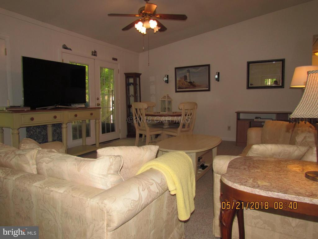 38 Sandyhook Road Ocean Pines, MD 21811 - Photo 5 of 33 a living room with furniture and a flat screen tv