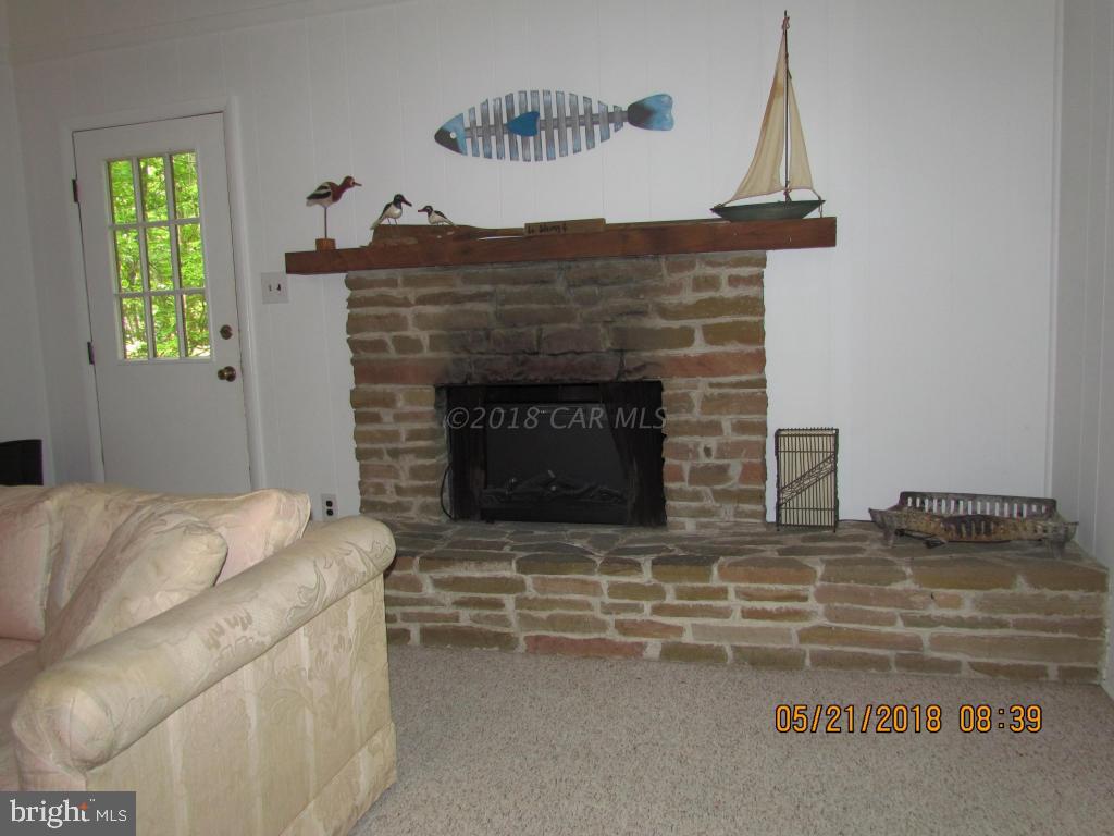 38 Sandyhook Road Ocean Pines, MD 21811 - Photo 6 of 33 a living room with furniture and a fireplace