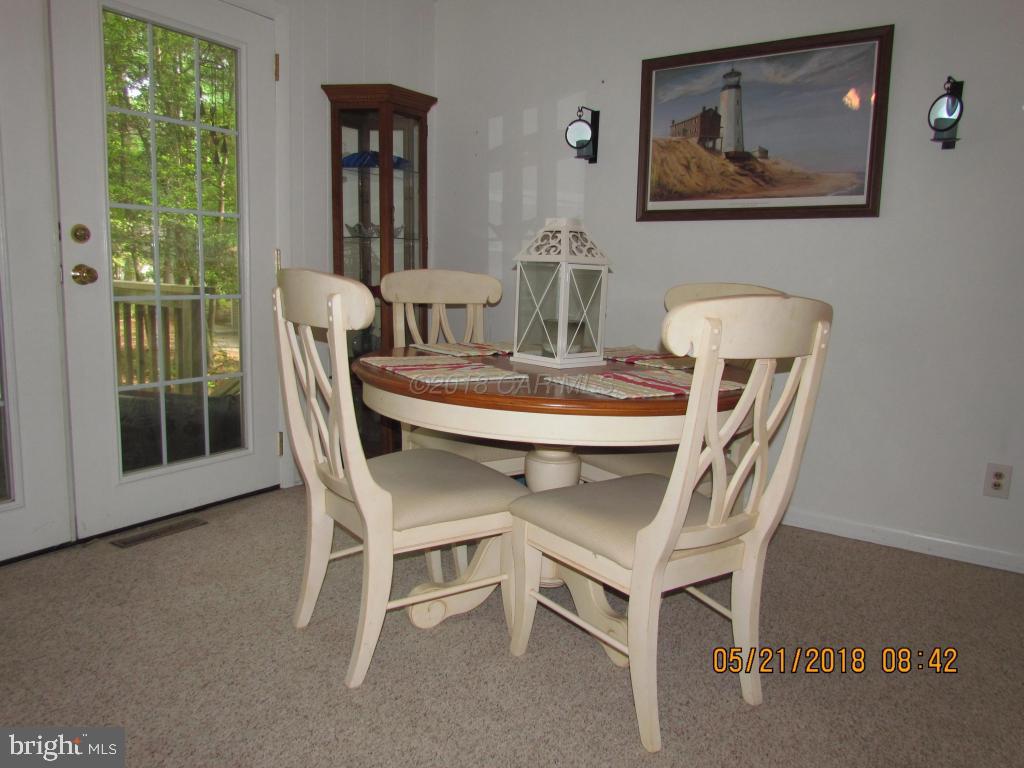 38 Sandyhook Road Ocean Pines, MD 21811 - Photo 9 of 33 a dining room with furniture and window