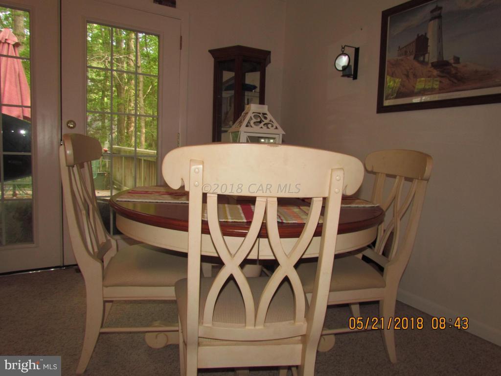 38 Sandyhook Road Ocean Pines, MD 21811 - Photo 10 of 33 a view of a dining room with furniture window and outside view