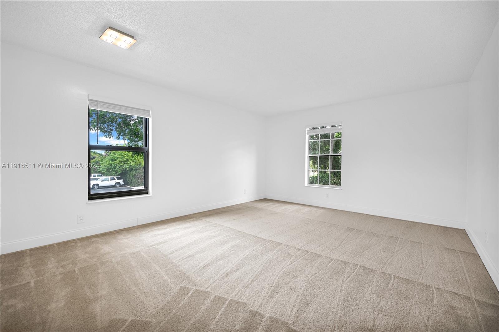7550 Stirling Road, Unit V210 Davie, FL 33024 - Photo 5 of 27 an empty room with windows