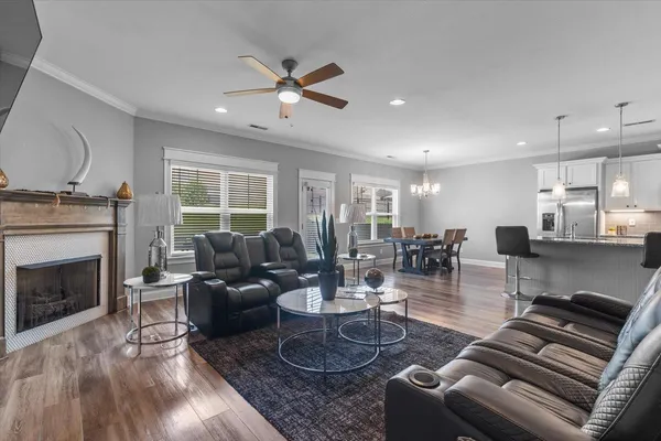 a living room with furniture and a fireplace