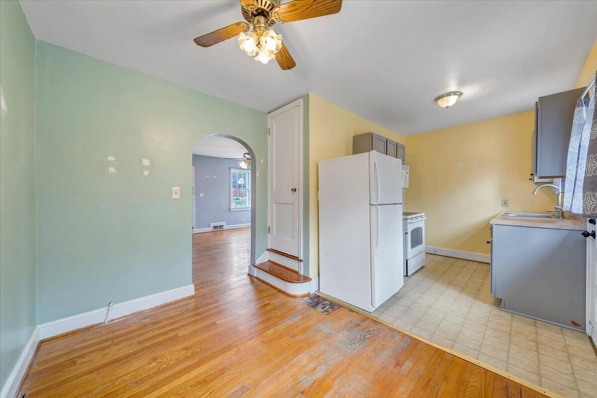 910 Brandon Avenue Southwest Roanoke, VA 24015 - Photo 11 of 50 a view of a kitchen cabinets and wooden floor
