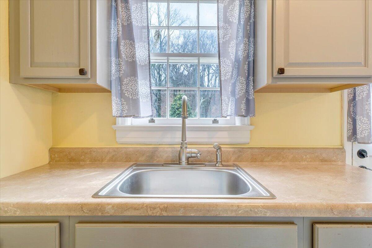 910 Brandon Avenue Southwest Roanoke, VA 24015 - Photo 14 of 50 a close view of a sink and a window