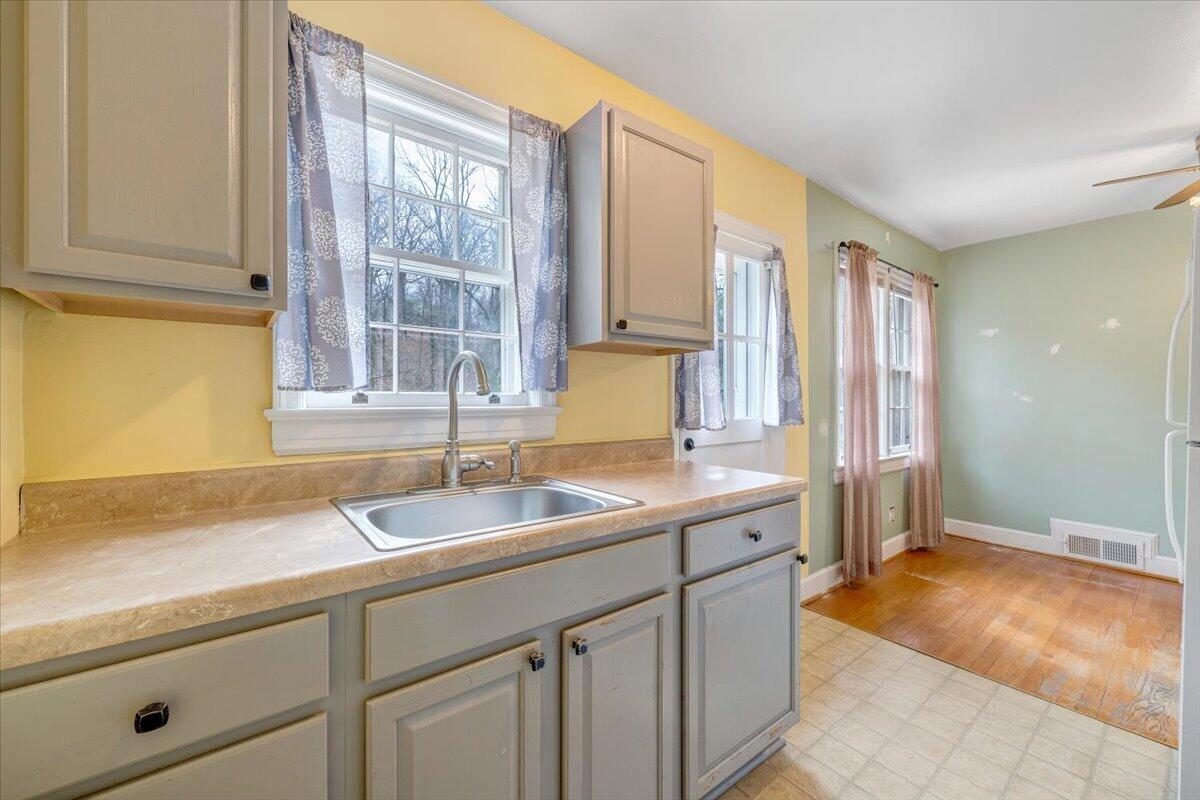 910 Brandon Avenue Southwest Roanoke, VA 24015 - Photo 15 of 50 a kitchen with a sink and a window