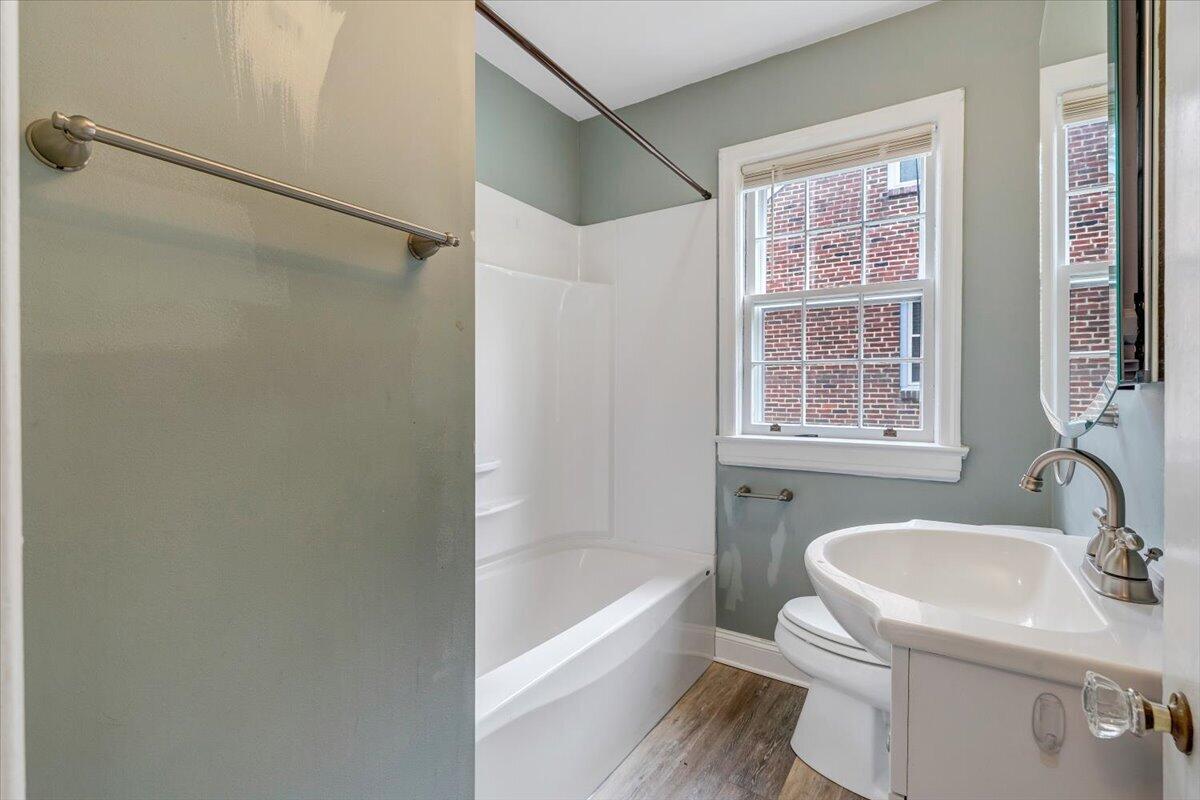 910 Brandon Avenue Southwest Roanoke, VA 24015 - Photo 21 of 50 a bathroom with a sink toilet and shower