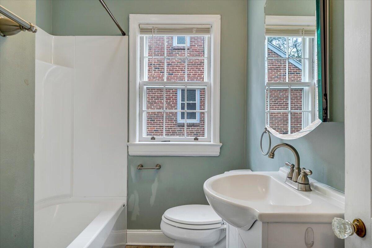 910 Brandon Avenue Southwest Roanoke, VA 24015 - Photo 22 of 50 a bathroom with a sink toilet and tub