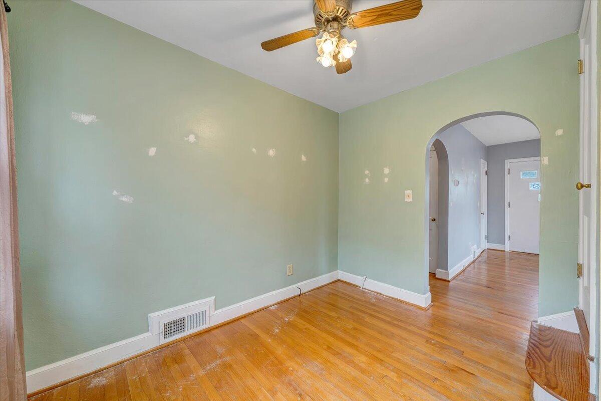 910 Brandon Avenue Southwest Roanoke, VA 24015 - Photo 9 of 50 a view of empty room with wooden floor