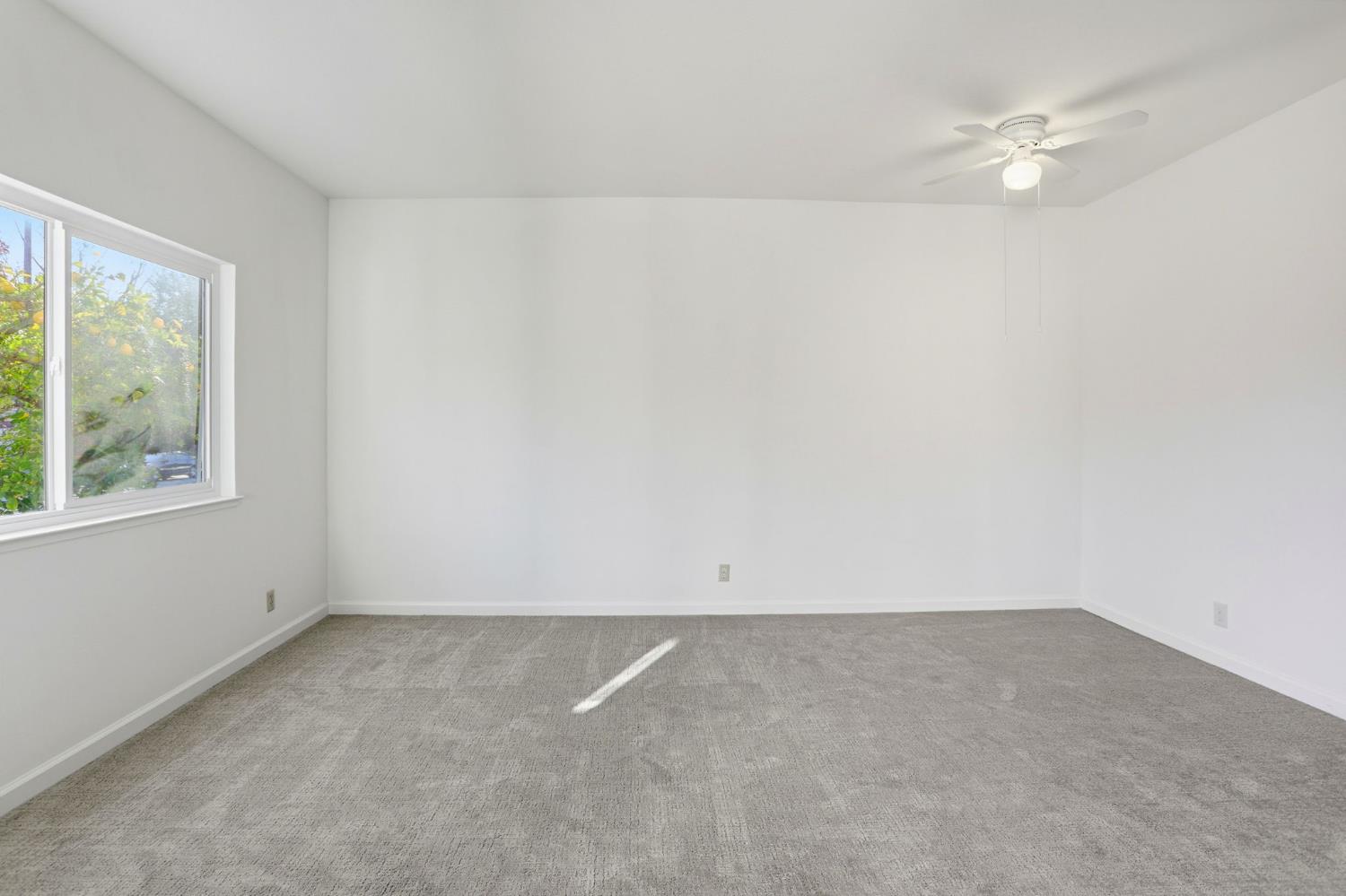 152 Hackamore Lane Fremont, CA 94539 - Photo 11 of 32 an empty room with a window and a ceiling fan