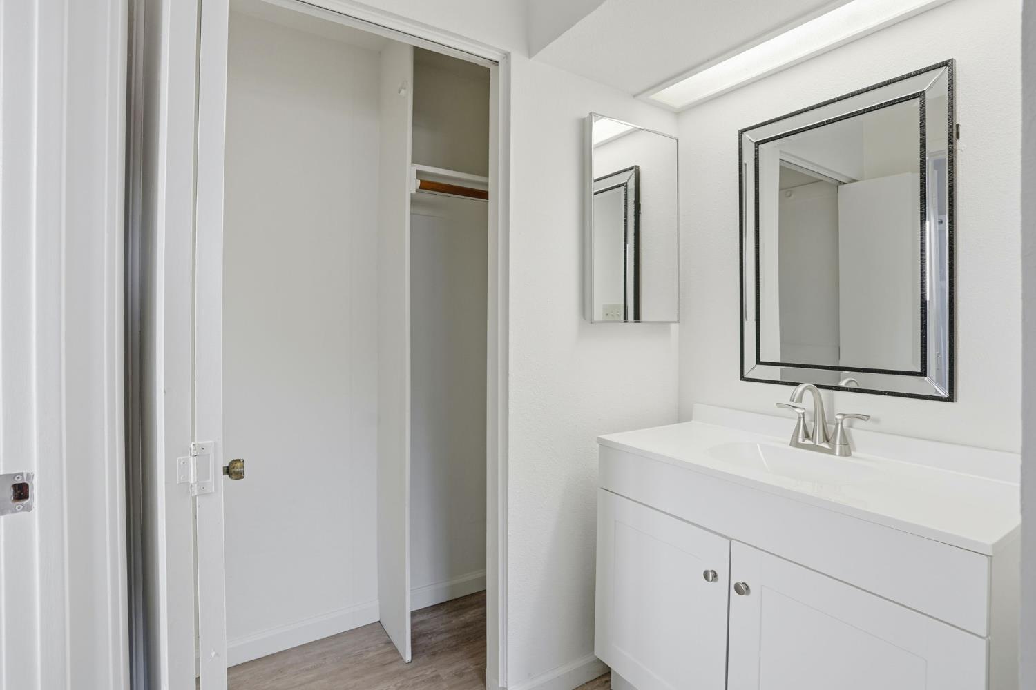 152 Hackamore Lane Fremont, CA 94539 - Photo 22 of 32 a bathroom with mirror a sink and vanity