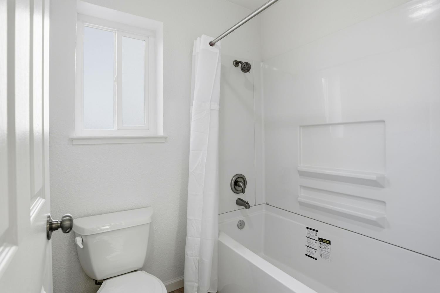 152 Hackamore Lane Fremont, CA 94539 - Photo 23 of 32 a bathroom with a toilet and a bathtub