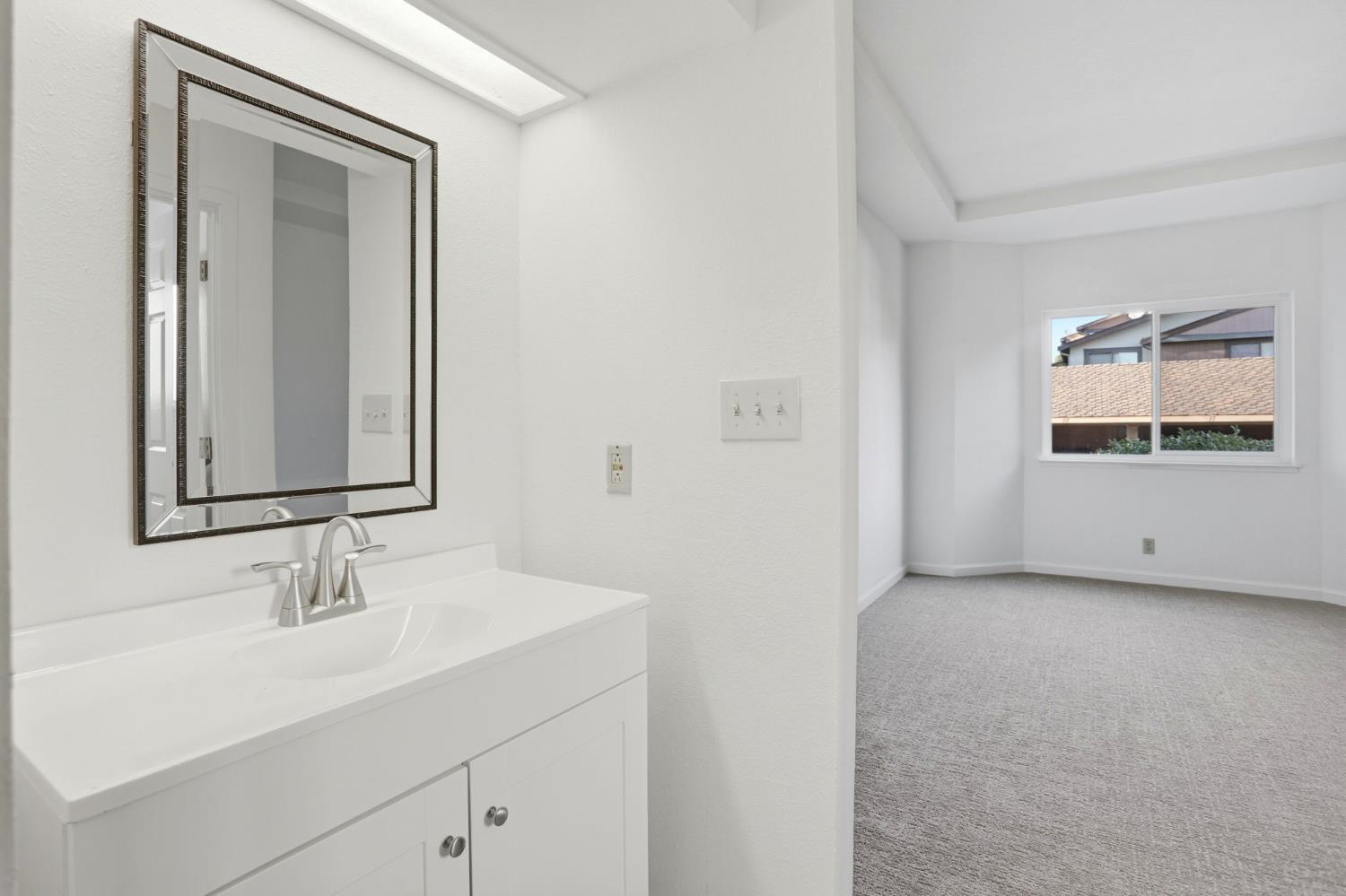 152 Hackamore Lane Fremont, CA 94539 - Photo 24 of 32 a bathroom with a sink and a mirror