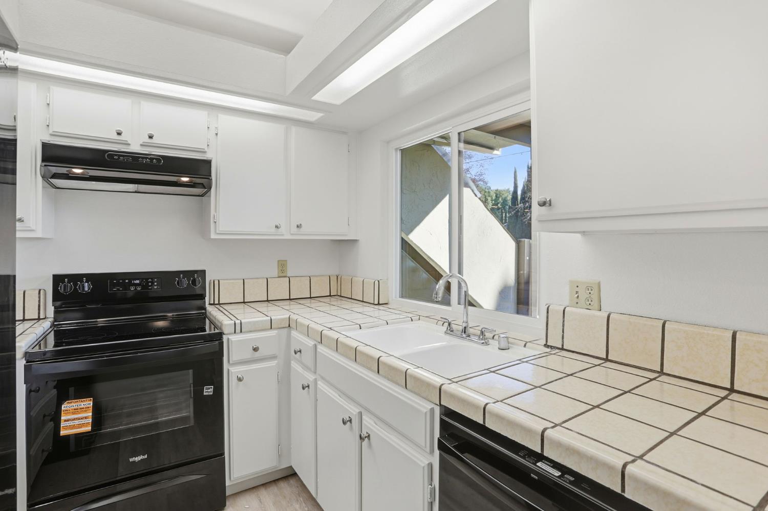 152 Hackamore Lane Fremont, CA 94539 - Photo 9 of 32 a kitchen with a sink stove and cabinets