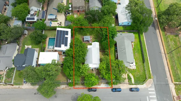 an aerial view of a house with a garden and plants