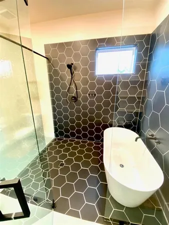 a bathroom with a sink and a shower
