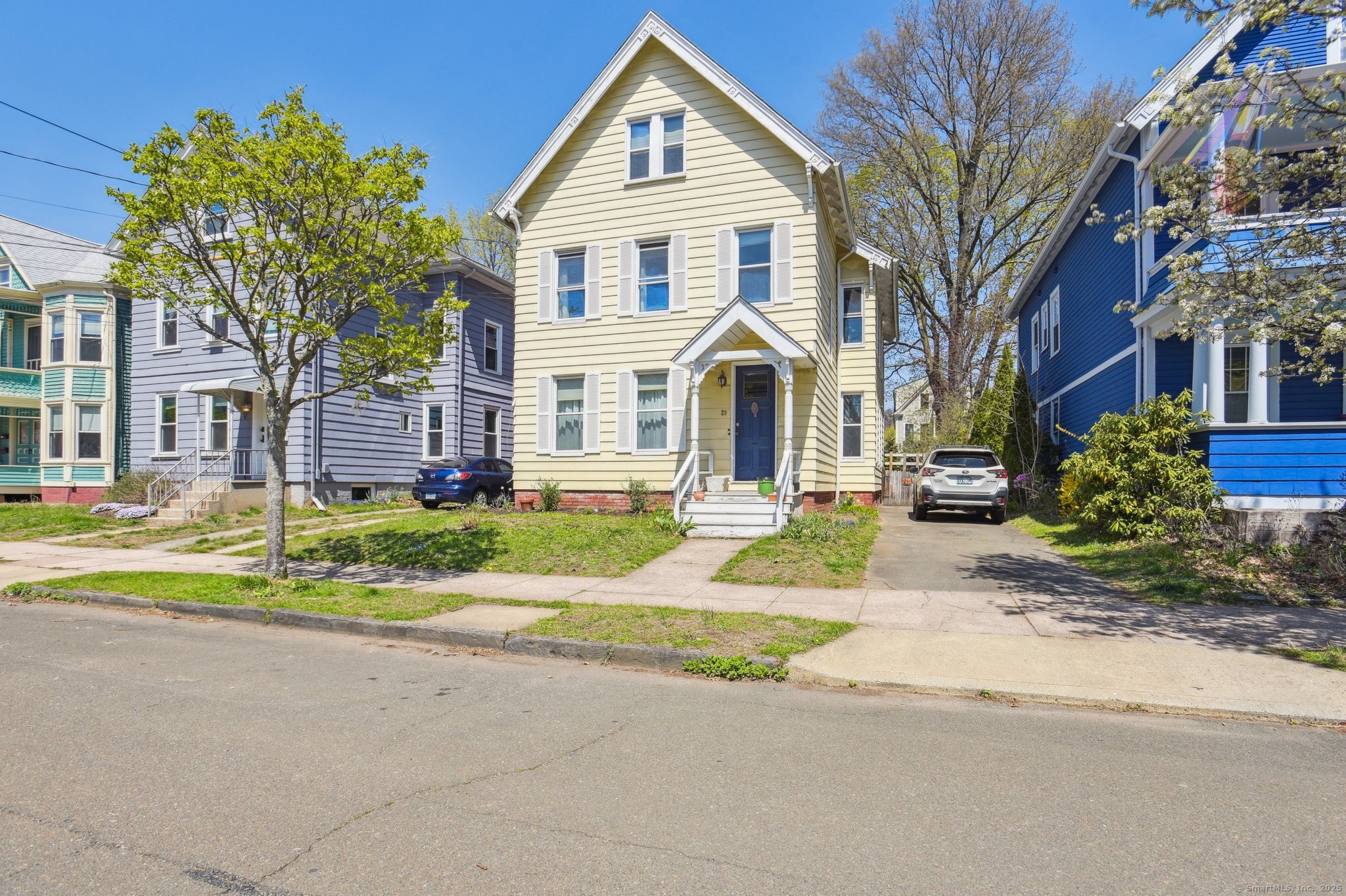 a front view of a house with a yard