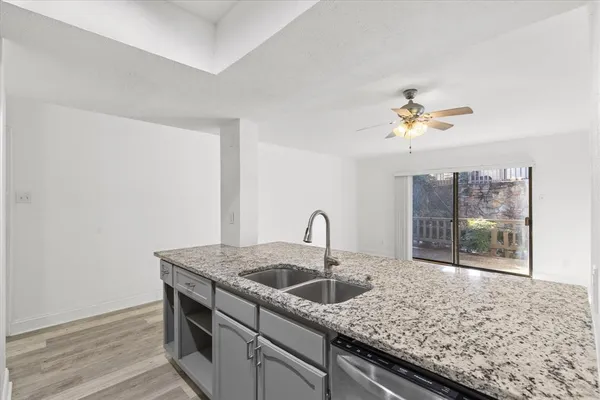 a kitchen with a sink and a coffee table