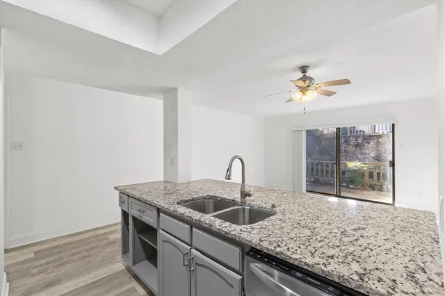 a kitchen with a sink and a coffee table
