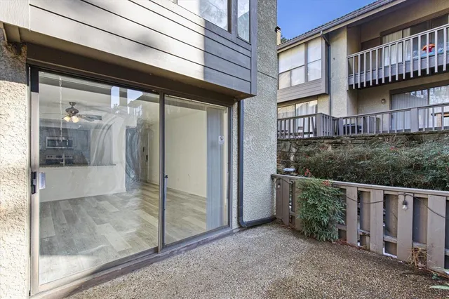 a view of a brick house with a large window