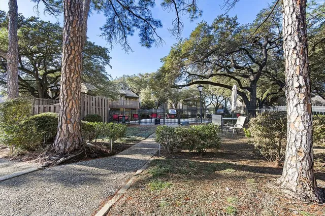a view of street along with trees