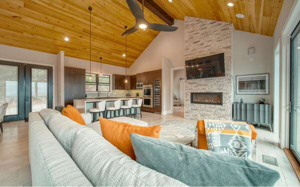 740 Chestnut Mountain Road Blairsville, GA 30512 - Photo 13 of 75 a living room with stainless steel appliances furniture a fireplace and a open kitchen view