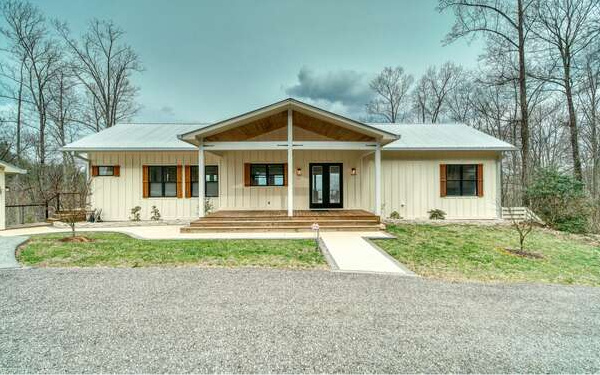 740 Chestnut Mountain Road Blairsville, GA 30512 - Photo 16 of 75 a front view of a house with garden