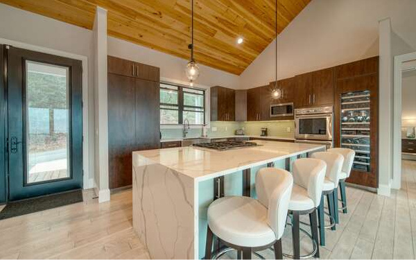 740 Chestnut Mountain Road Blairsville, GA 30512 - Photo 18 of 75 a large kitchen with a table and chairs