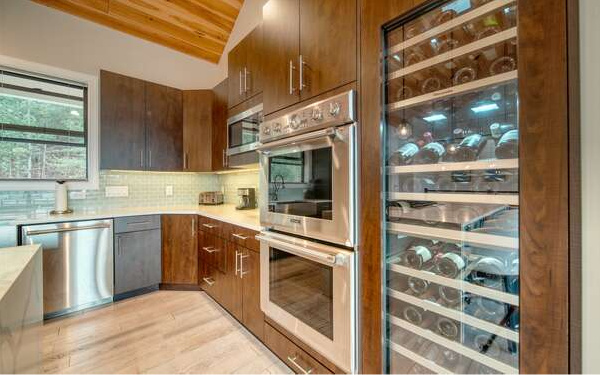 740 Chestnut Mountain Road Blairsville, GA 30512 - Photo 21 of 75 a kitchen with stainless steel appliances granite countertop a stove and a sink