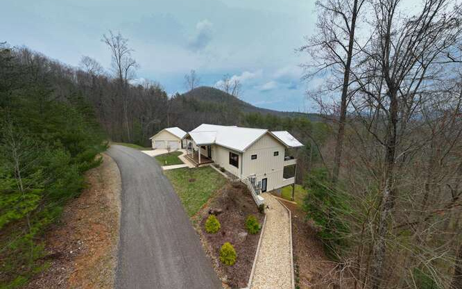 740 Chestnut Mountain Road Blairsville, GA 30512 - Photo 23 of 75 a view of a house with a yard