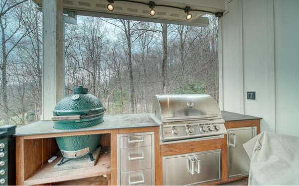 740 Chestnut Mountain Road Blairsville, GA 30512 - Photo 40 of 75 a kitchen with a stove and a white cabinet