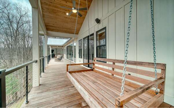 740 Chestnut Mountain Road Blairsville, GA 30512 - Photo 43 of 75 a view of a balcony with chairs and wooden floor