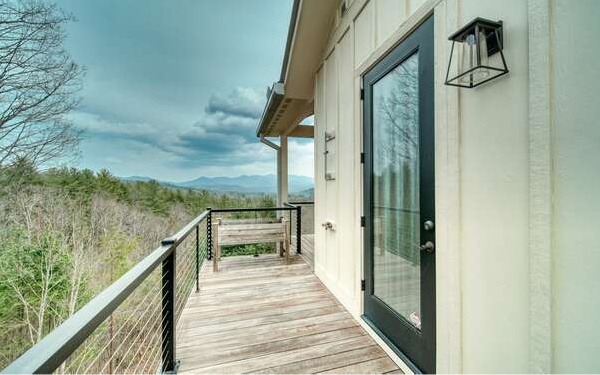 740 Chestnut Mountain Road Blairsville, GA 30512 - Photo 46 of 75 a view of a balcony with wooden floor and stairs