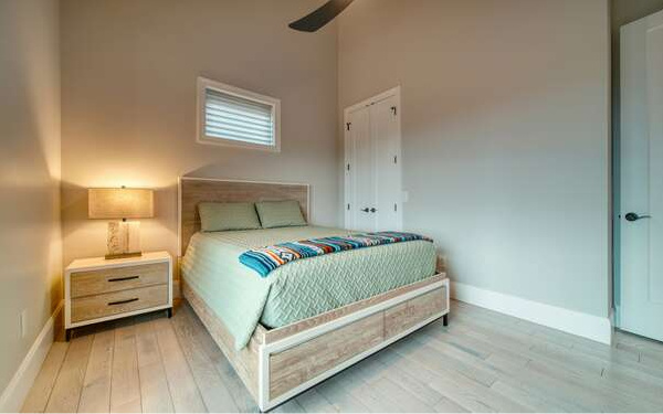 740 Chestnut Mountain Road Blairsville, GA 30512 - Photo 55 of 75 a bedroom with a bed and a night stand