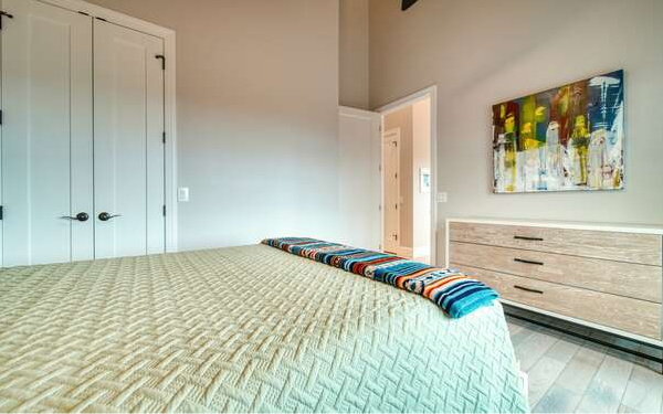 740 Chestnut Mountain Road Blairsville, GA 30512 - Photo 56 of 75 a bed room with a bed and a painting on the wall