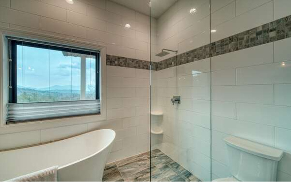 740 Chestnut Mountain Road Blairsville, GA 30512 - Photo 59 of 75 a bathroom with a shower and a bathtub