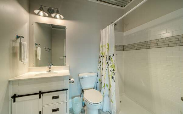 740 Chestnut Mountain Road Blairsville, GA 30512 - Photo 63 of 75 a bathroom with a sink toilet vanity and shower