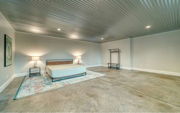 740 Chestnut Mountain Road Blairsville, GA 30512 - Photo 67 of 75 a spacious bedroom with a bed and a night stand