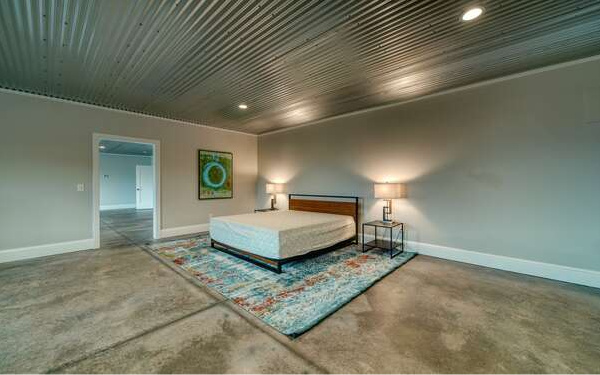 740 Chestnut Mountain Road Blairsville, GA 30512 - Photo 69 of 75 a bedroom with a bed and a night stand