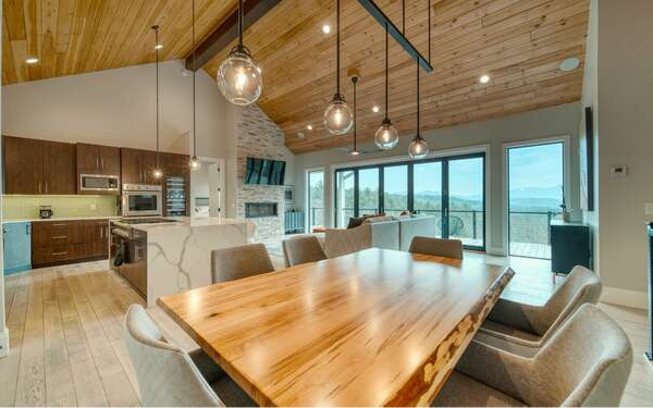 740 Chestnut Mountain Road Blairsville, GA 30512 - Photo 9 of 75 a living room with stainless steel appliances granite countertop a couch a dining table and chairs with the wooden floor