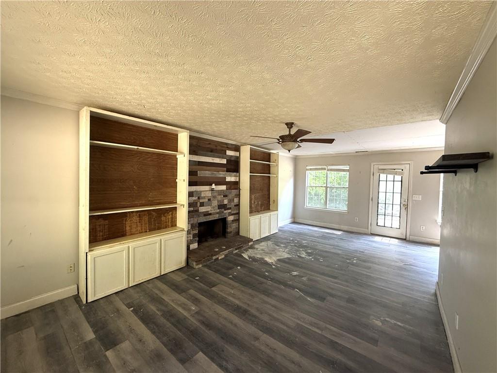 7251 Williams Road Flowery Branch, GA 30542 - Photo 3 of 10 an empty room with windows and closet