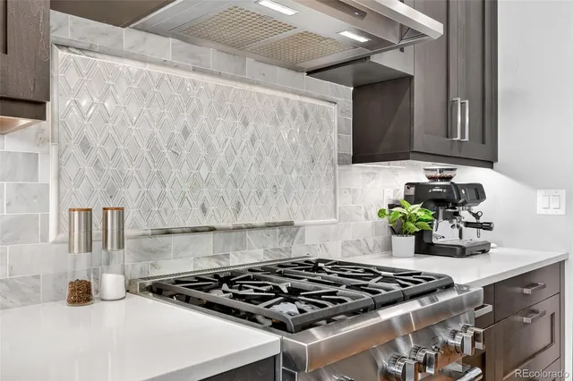 a kitchen with a stove and cabinets