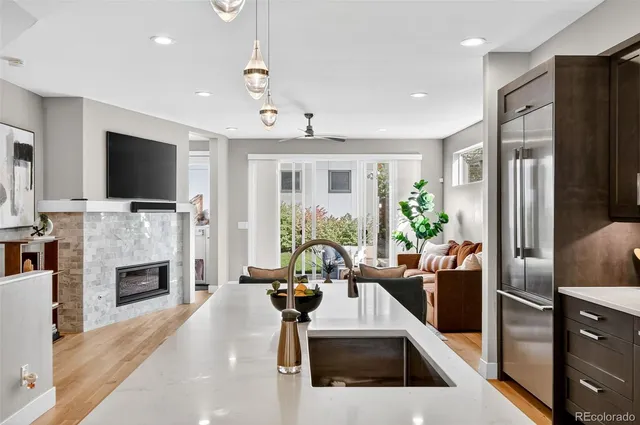 a living room with fireplace furniture and a flat screen tv