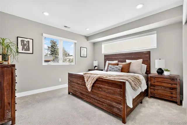 a bedroom with bed and a window