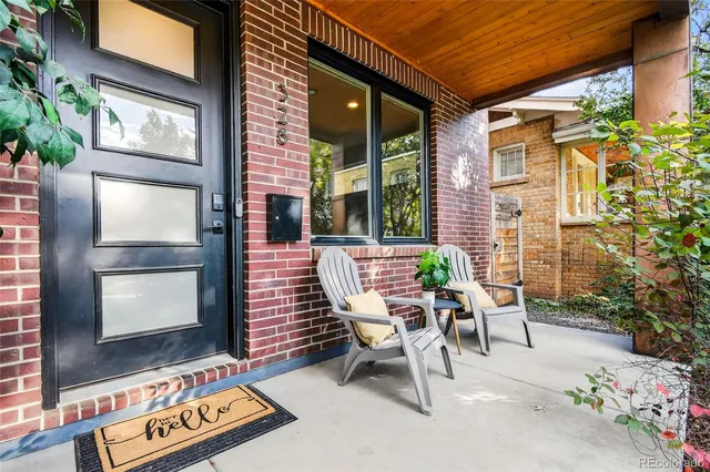 a view of a two chairs in the patio
