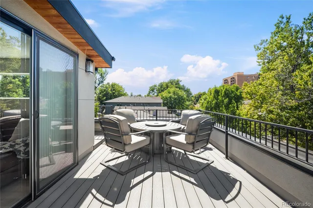 a view of balcony with furniture