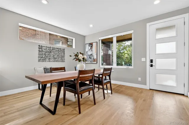 a view of a dining room with furniture window and wooden floor